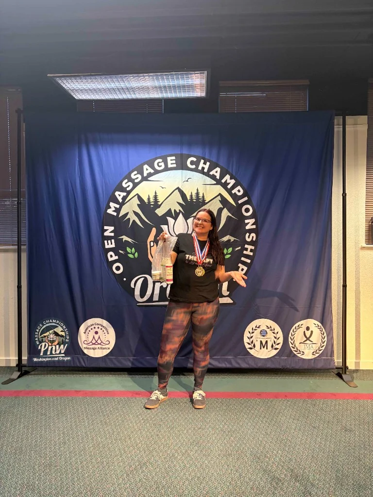 Kacie Hinojosa with her gold medal at the Open Massage Championship, Oregon